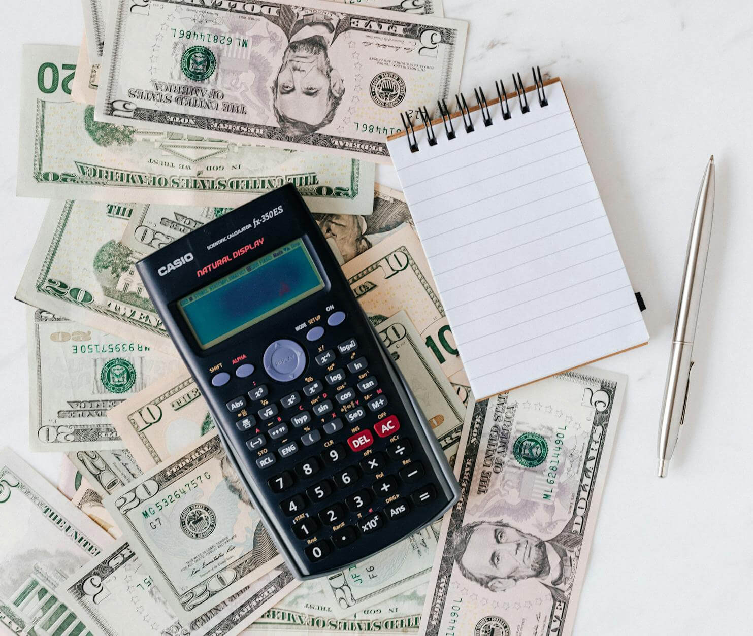 Calculator and financial records arranged on a desk